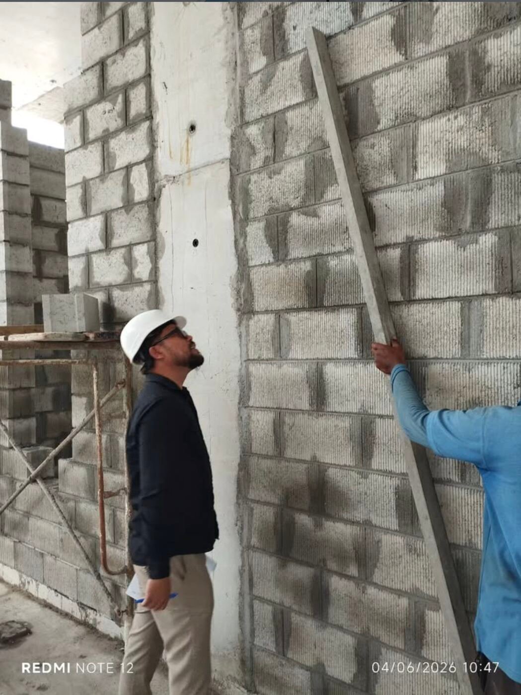 Gravity Contracting site crew finishing an interior wall